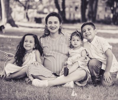 greyscale photo of woman and children